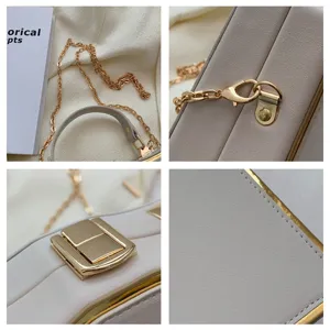 Close-up details of beige structured box handbag, showing golden metal chain, clasp and fine stitching.