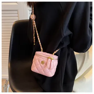 Pink quilted chain mini vanity bag, classic box shoulder crossbody bag detail view.
