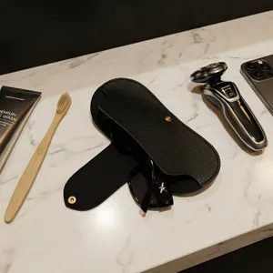 Black leather-textured glasses case portable sunglasses pouch organizer with snap button.