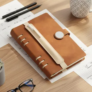 Brown PU leather notebook with elastic pen holder strap and magnetic buckle for daily office and study use.