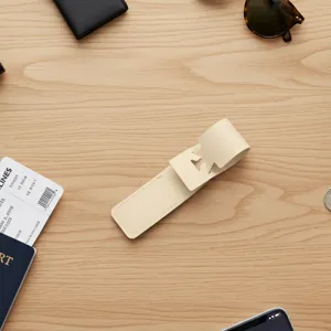 Creative PU leather luggage tag detail shot, beige travel tag with hollow airplane design.