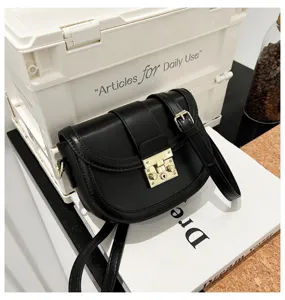 Stylish black leather saddle bag for women, classic shoulder crossbody design with lock.