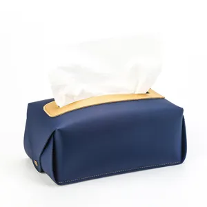 Vue détaillée du porte-boîte à mouchoirs carré en cuir PU bleu et doré de luxe élégant.