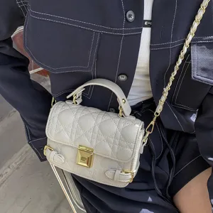 Quilted chain crossbody bag for women, elegant small shoulder bag with top handle.