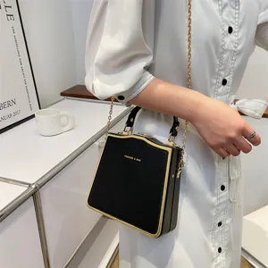 Chic black and gold box handbag for women, elegant chain crossbody bag for daily fashion.