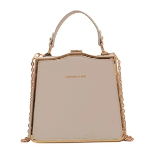 Chic beige structured top handle bag with gold chain strap for women daily fashion wear.