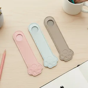 Cute paw shape PU leather pen sleeve detail, creative stationery organizer for student notebook.