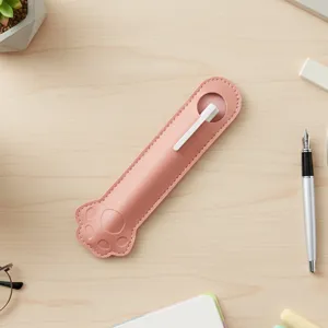 Cute pink paw design PU leather single pen sleeve detail close up on wooden desktop