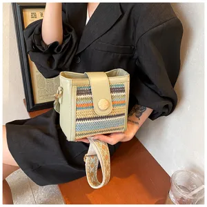 Fashion woven bucket bag for women, stylish crossbody shoulder bag with wide strap for daily use.
