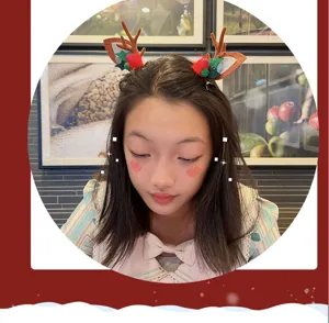 Cute Christmas reindeer antler hair clip, festive holiday hair accessory for girls.