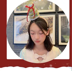 Detailed view of cute plush Christmas tree headband for girls, perfect for holiday photos & parties.