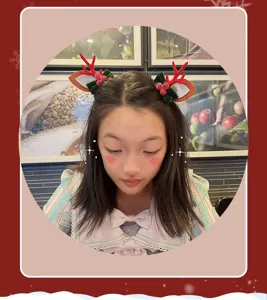 Christmas reindeer antler hair clips for kids, green bow and red berries cute holiday hair access.
