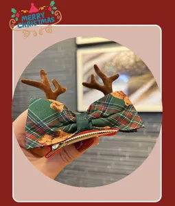 Christmas plaid hair bow detail shot featuring soft reindeer antlers and metallic clip.