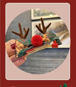 Christmas reindeer antler hair clip with plaid bow and bear, cute kids holiday accessory.