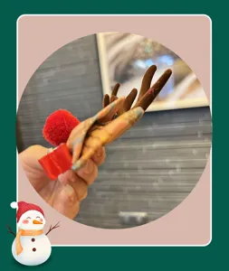 Children Christmas reindeer antler hair clip with cute plaid bow and red pom-pom design.