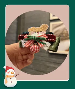 Christmas bow hair clip with cute embroidered bear design, festive red and green hair accessories for kids.