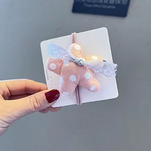 Élastique à cheveux étoile en tissu à pois de printemps avec joli nœud pour les filles.