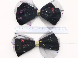 Molletta per capelli nera per bambini con fiocco e stelle glitterate colorate per feste.