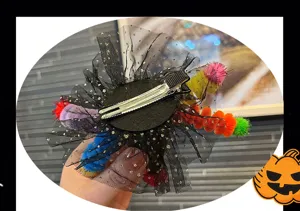 Close-up detail showing the back metal alligator clip and black mesh of the Halloween hairpin.