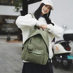 Lässiger grüner Canvas-Rucksack für das Pendeln und Reisen mit großem Fassungsvermögen.