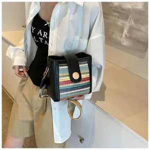 Fashionable woven bucket bag with wide strap, trendy crossbody design for women daily wear.
