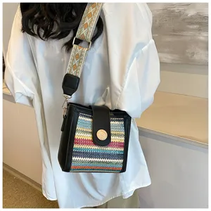 Stylish women's woven bucket bag with wide strap, trendy crossbody shoulder bag for daily use.