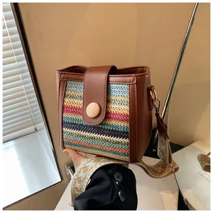 Woven bucket shoulder bag with wide strap, trendy retro style women crossbody handbag for daily use.