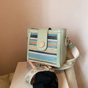 Stylish women's woven bucket shoulder bag with wide strap, trendy casual crossbody handbag.