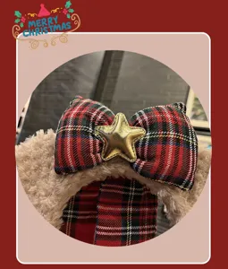 Detailed view of Christmas plush bow headband with gold star, soft winter hair accessory.