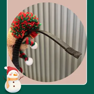 Christmas plush headband detail view, colorful pom-pom hair hoop, festive hair accessory.