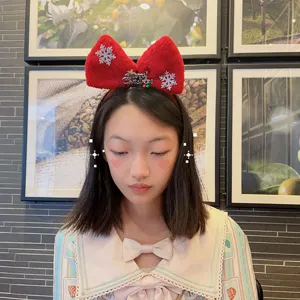 Kids Christmas red plush bow headband with glitter snowflake for holiday party dress up.