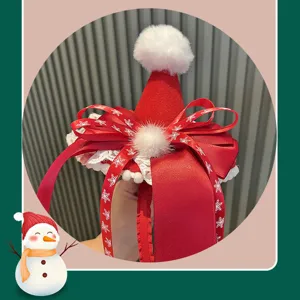 Christmas red mini Santa hat headband with big ribbon and white pom pom for festive party.