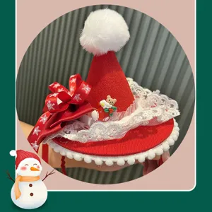 Christmas hat headband detail shot, red velvet with white lace and cute bear charm.