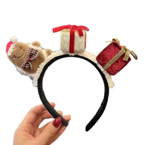 Christmas headband with gingerbread man and gift box, festive hair accessory for women.