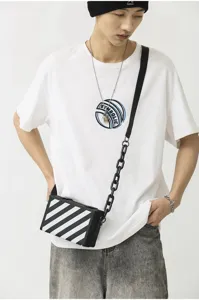 Sac bandoulière boîte tendance à rayures diagonales noires et blanches, sac élégant.