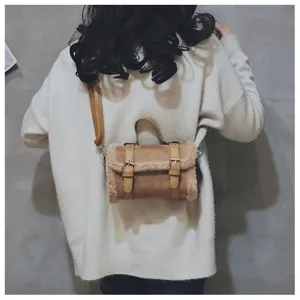 Stylish autumn winter plush shoulder bag detail view, trendy brown crossbody handbag for women.
