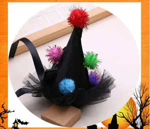 DIY Halloween mini witch hat hair clip accessory with colorful pom-poms and black tulle.