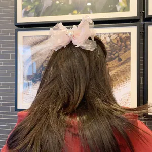 Pink mesh bow hair clip for girls, cute tulle hair accessory with crown pearl for party.
