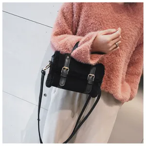 Stylish women's black plush crossbody bag with double buckle flap for autumn and winter.
