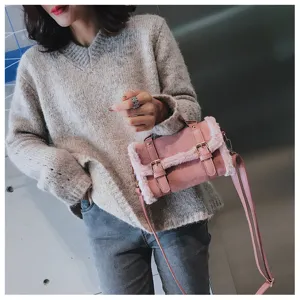 Chic pink plush crossbody bag with metal buckle, stylish autumn winter satchel for women.