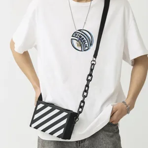 Sac bandoulière boîte rayé noir et blanc unisexe avec bandoulière chaîne épaisse mode.