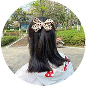 Girl caramel polka dot bow hair clip cute handmade hair accessory for children daily wear.