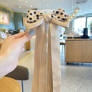 Cute girls hair clip with big polka dot bow and long ribbons, trendy hair accessory