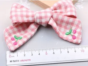 Pink gingham cherry embroidered bow hair clip detail, sweet style hair accessory for girls.