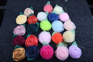 Multicolor handmade fabric rose flowers with green leaves for DIY hair and clothing accessories.
