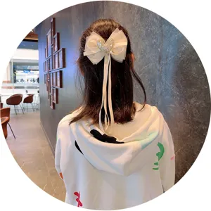 Children mesh bow hair clip with pearl heart, sweet Korean style hair accessory for girls.