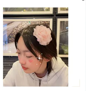 Detailed view of a Korean style 3D handmade burnt-edge flower hair clip, charming pink camellia.