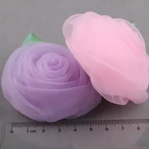 DIY fabric rose flower accessories craft material detail view showing size on ruler.
