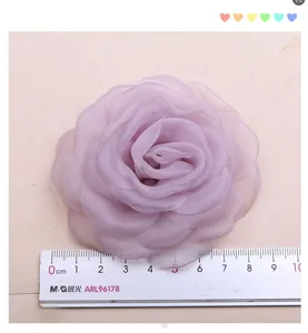 Handcrafted organza camellia flower DIY hair accessory material for wedding dress apparel.