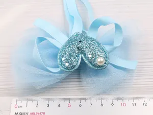 Children hair accessory blue mesh bow hairpin with glitter heart and pearl detail.